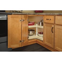 an open cabinet in the corner of a kitchen