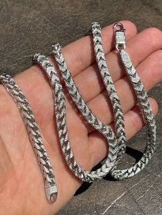 "Men's custom handmade franco chain 20-30ct Simulated Diamonds (High grade CZ, 5A stones for a truly amazing iced out look 18-24\" long 6mm thick 67-91 grams (depending on length...24\" weighs 91 grams) HEAVY Stamped 925 This piece is entirely hand made ...all stones that were all set by hand Sterling silver finished in rhodium Will never turn your neck green We also sell a matching bracelet that would make a beautiful set!!" White Gold Iced Out Cuban Link Necklace, Silver Cuban Link Necklace Iced Out With Cubic Zirconia, Silver Cuban Link Necklace With Iced Out Cubic Zirconia, Iced-out White Gold Cuban Link Necklace, Diamond Cuban Link Necklace With Silver Chain, Silver Cuban Link Chain Necklace Iced Out, Silver Diamond Cuban Link Necklace, Silver Iced Out Cuban Link Necklace, Iced Out Silver Cuban Link Necklace