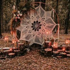 an outdoor wedding ceremony setup with candles and crocheted doily