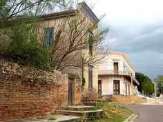 an old brick building with steps leading up to it