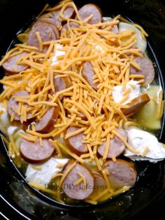 hotdogs and cheese are being cooked in the slow cooker to make an appetizer