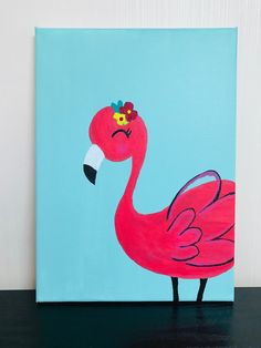 a painting of a pink flamingo with a flower in its beak on a blue background