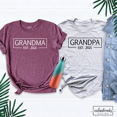 Grandma And Grandpa Est. Shirt, Baby Announcement Shirt, Grandma and Grandpa Shirts, Grandparents Couple Shirts, Matching Family Shirt. Hi! Welcome to our store. It's good to see you here. Our aim is to offer you first-class clothing in your most beautiful moments with our graphic t-shirts that we designed or designed with your ideas. I am sure you will like our designs for your family, friends and you. IMPORTANT MATTERS FOR ORDERING: 1-) Please check and review all photos. 2-) Our sizes are tru Cotton Tops With Name Print For Family Reunion, Cotton Crew Neck Top For Family Reunion, Relaxed Fit Cotton Tops For Family Reunion, Cotton Tops With Relaxed Fit For Family Reunion, Text Print Crew Neck Top For Family Reunion, Cotton Screen Print Tops For Family Reunion, Relaxed Fit Family Matching Tops For Gift, Purple Crew Neck Top With Name Print, Relaxed Fit Crew Neck Shirt For Family