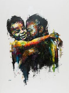 two people hugging each other with paint splattered on them