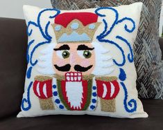 a decorative pillow with an image of a nutcracker on it