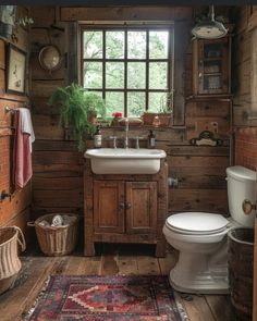 a rustic bathroom with wood paneling and tile flooring, along with a rug on the floor