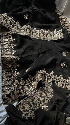 KreatvKraft Vintage Sari | Pure Organza Sari | Indian Black Sarees | Banarasi Brocade Fabric by the yard Silk Fabric Discover Timeless Beauty - Black Organza Saree with Gottapatti Zardozi & Pearl Sequins Step into the world of timeless elegance with our Midnight Elegance Saree. This premium black organza saree is a masterpiece of craftsmanship, adorned with gottapatti zardozi handwork and pearl sequins detailing. The inspiration for this exquisite saree came from a desire to blend traditional ar Black And Silver Saree, Heavy Work Saree, Black Organza Saree, Black Party Wear, Black Sarees, Organza Sari, Black Sari, Sari Traditional, Saree Black