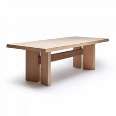 a wooden table sitting on top of a white floor