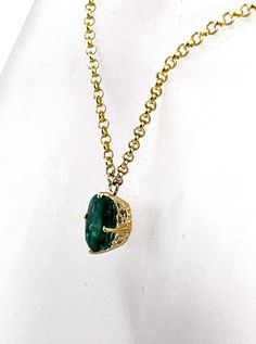 Natural, Oval Shape Green Emerald  set in 14 karat Yellow Gold Ornamental Frame and suspended from 16 inch long 10 karat Yellow Gold Rolo Chain. The Emerald weighs 2.04 carat and measures 9x7 millimeters The necklace all total weighs 2.03 grams Formal Oval Necklace With 17 Jewels, Formal Oval Necklaces With 17 Jewels, Luxury Oval Necklace With Prong Setting, Luxury Yellow Gold Emerald Necklace With Prong Setting, Formal Oval Link Necklace, Hallmarked, Formal Oval Link Necklace Hallmarked, Formal Oval Link Hallmarked Necklace, Formal Hallmarked Oval Link Necklace, Luxury Oval Solitaire Necklace For Formal Occasions