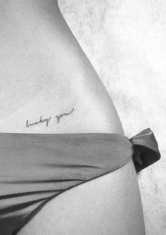 a woman's stomach with the word lucky girl written on it