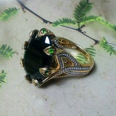 Like New. The Power Ring Fit For A Queen. Gold Over 925 Silver With Genuine Black Spinel And Vivid, Crisp Green Russian Diopside. Let This Be The Ring You Reach For Whenever You Need To Make A Statement Or Just Be Heard. Invest In Quality Jewelry That You Will Have Forever. Be Proud To Wear Or Give As A Gift. Be The Queen Who Gets This One. Truly Stunning And Beautiful From All Angles. Firm. Firm. Firm. Firm. Luxury Tsavorite Jewelry With Gemstone Accents, Elegant Tourmaline Cabochon Jewelry, Elegant Tsavorite Rings With Polished Finish, Luxury Hallmarked Tsavorite Jewelry, Elegant Tourmaline Jewelry With Accent Stones, Luxury Tourmaline Jewelry For Formal Occasions, Goth Ring, Power Ring, Black Spinel