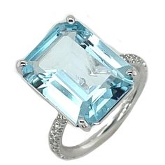 This gorgeous platinum ring features a large, 10.51 carat, emerald-cut blue topaz with beautiful bright, sky blue color! 24 sparkling diamonds weighing .50 carat total have been masterfully set by hand in the rounded band for a look that is stunning from all angles! A contemporary look that will never go out of style, this ring is perfect for every day and special occasions! Handcrafted in platinum by our Master Jewelers in Los Angeles. Blue topaz, 15.66 x 11.78 x 6.13mm, 10.51 carats Size 6.25 Sky Blue Color, Diamond Cocktail Rings, Platinum Ring, Sparkle Diamonds, Round Brilliant Cut Diamond, Cocktail Ring, Brilliant Cut Diamond, Cocktail Rings, Emerald Cut