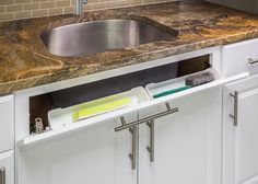 a kitchen sink with the bottom half removed from it's cabinet and underneath it