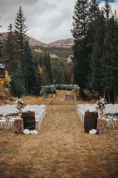 an outdoor wedding setup in the woods