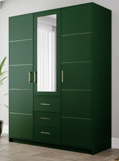 a green armoire with two mirrors on it