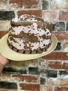 A  clean looking hat and a show stopper.This Fedora is beautiful and unisex. The fedora looks great for the summer.The cowrie shell makes this hat stands out.Comfortable fits small to med size heads.Don't delay order yours today. Western Style Top Hat For Summer Festivals, Western Style Summer Festival Top Hat, Country Style Short Brim Top Hat For Summer, Country Style Summer Top Hat With Short Brim, Country Style Top Hat With Curved Brim For Summer, Western Style Fedora Top Hat For Summer, Country Style Brimmed Top Hat For Beach, Western Fedora Top Hat For Summer, Country Style Adjustable Top Hat For Summer