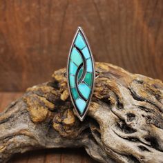 Vintage sterling silver inlaid turquoise ring. The ring is 2 1/8" long x 5/8" wide. Some of the turquoise has changed color over the years. Natural turquoise will do this when it is in contact with skin oil or chemicals. The ring is size 9. It looks like the work of Zuni Amy Quandelacy or Wesley but is not signed. The ring is in good condition. Thank you for shopping in our store. Please let us know if you have questions. RING-1798K-MS-7 k *The color you see on your screen may not reflect the ac Vintage Green Turquoise Ring With Inlay, Southwestern Style Turquoise Inlay Ring, Skin Oil, Tucson Az, Oils For Skin, Natural Turquoise, Tucson, Rings Statement, Vintage Sterling Silver