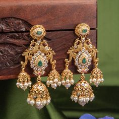 Beautiful peacock design Gold Wedding earrings embedded with Diamonds,Pearls and Emeralds. Gold Wedding Earrings, Pearls Jewellery, Bridal Jewellery Earrings, Gold Jhumka Earrings, Antique Necklaces Design, Gold Jewelry Outfits, Gold Earrings Models, Bridal Jewelry Vintage, Modern Gold Jewelry