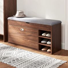 a wooden bench with shoe storage underneath it