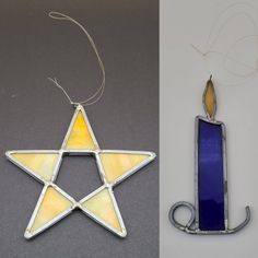 an ornament made out of stained glass with a candle in the shape of a star