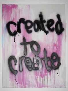 the words created to create are spray painted in black and pink