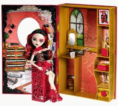 a doll in a red dress sitting inside of a book case next to a mirror