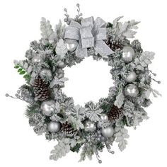 a christmas wreath with silver balls, pine cones and snowflakes on white background