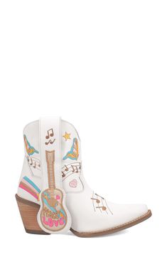 Channel unmistakable Music City vibes with this Western-inspired short boot covered in colorful retro embroidery. 3" heel 7" shaft Pull-on style Cushioned footbed Leather upper/textile lining/synthetic sole Imported White Embroidered Round Toe Boots, White Embroidered Snip Toe Boots, White Embroidered Western Boots, Retro Embroidery, City Vibes, Short Boot, Western Boots Women, City Vibe, Western Boot