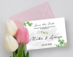 two tulips are in front of an envelope with the word save the date on it