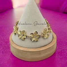 This plumeria bracelet features cubic zirconia stones in each plumeria flower. Easy to put on and take off with lobster closure clasp. The plumeria flowers on this bracelet measures 18mm width. This bracelet has an attached 3 inch extender so you can adjust to your size from 6.5 - 9 inch wrist.  Here is the matching earrings: https://www.etsy.com/listing/1774987703/plumeria-stud-earrings-hawaiian-earrings?click_key=f3a4bd8dd45cc1d5495ac734b87db37181ed5605%3A1774987703&click_sum=6050e810&ref=shop_home_active_2 Hawaii Bracelets, Plumeria Bracelet, Bratz Tv Show, Hawaiian Earrings, Jewelry Gold Bracelet, Hawaiian Bracelets, Hawaii Jewelry, Plumeria Flowers, Hawaiian Jewelry