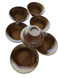 six wooden bowls stacked on top of each other