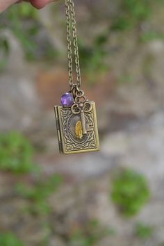 PLEASE read my shop announcement before placing an order so you know what to expect right now. Plus, when ordering from outside Europe, don't forget to provide a phone number for the courier to ensure the fastest and smoothest delivery. Small book locket necklace with a raw brass feather or quill on its cover, and a key and an amethyst stone dangling from the chain. Just cute and perfect gift for a writer. I made this necklace as writing is my greatest and true passion and couldn't help making a Personalized Bookish Necklace For Gift, Spiritual Brass Locket Necklace For Gift, Spiritual Vintage Charm Necklace For Gifts, Spiritual Vintage Charm Necklaces As Gift, Handmade Spiritual Locket Necklace For Gift, Spiritual Nickel-free Locket Necklace Gift, Spiritual Handmade Locket Necklace Gift, Nickel-free Spiritual Locket Necklace As Gift, Personalized Spiritual Locket Necklace Gift