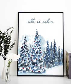 a christmas card with the words all is calm in front of some flowers and books