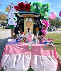 a car decorated with paper flowers and decorations