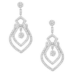 Make a statement with our breathtaking Illusional Diamonds Dangle Earrings. Crafted in 18k white gold, these earrings feature a mesmerizing design that creates the illusion of a larger, more elaborate diamond. 18KT:13.08g; Diamond:4.98ct, Diamond Dangle Earrings, Vs Diamond, Diamond White, Jaipur, Jewelry Earrings Dangle, Dangle Earrings, Jewelry Earrings, Diamonds, White Gold