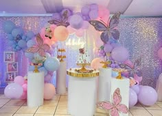 a room filled with balloons and decorations