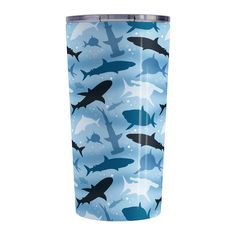 a blue camo print tumbler with sharks on it