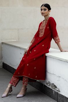 Red kurta in chanderi silk base fabric with floral motif embroidery. Paired with mul embroidered pant and organza dupatta.
Components:3
Pattern:Embroidered
Type of Work:Floral Motif
Neckline:V-Neck
Sleeve Length:Three Quarter
Fabric:Kurta: Chanderi Silk- 80% Cotton, Pant: Mul- 100% Cotton, Dupatta Organza
Color:Red
Other Details:
Floral motif embroidery
Embroidered pant hem
Occasion:Wedding, Puja - Aza Fashions Festive Chanderi Churidar With Floral Embroidery, Festive Churidar With Floral Embroidery In Chanderi, Red Unstitched Cotton Silk Suit With Resham Embroidery, Elegant Red Unstitched Suit With Floral Embroidery, Red Cotton Silk Unstitched Suit With Straight Kurta, Red Chanderi Churidar With Chikankari Embroidery, Red Churidar With Floral Embroidery In Chanderi, Red Chanderi Churidar With Floral Embroidery, Festive Slub Silk Churidar With Floral Embroidery