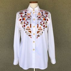 Amazing Deadstock Vintage Early 90s Escada Top. Original Tags Still Attached. White Cotton Boyfriend Style Women’s Button Down. Gold Buttons. Front Western Style Colorful Embroidery. Such A Stunning Timeless Top. Love This Piece, But It’s Sat In My Closet Unworn. On The Fence About Selling So Can’t Go A Ton Lower On Price. Length 27” Pit To Pit 21”. White Embroidered Button-up Shirt, Embroidered White Shirt For Work, Embroidered White Shirt For Workwear, White Embroidered Shirt For Workwear, White Embroidered Top For Work, White Embroidered Tops For Workwear, Traditional White Blouse With Buttons, Traditional White Button-up Tops, Traditional White Button-up Shirt