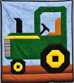 a quilt with a green tractor on it