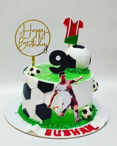 a soccer themed birthday cake with the number nine on it