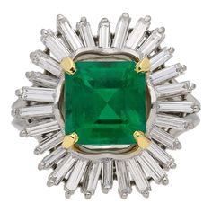 Emerald and diamond coronet cluster ring by Boucheron Paris, French, circa 1960. A yellow gold and platinum ring set with one central square emerald-cut untreated Colombian emerald in a yellow gold claw setting with an approximate weight of 2.60 carats, encircled by an undulating single border of twenty eight rectangular baguette cut diamonds in claw settings with an approximate total weight of 1.50 carats, to a ballerina cluster, flanked by split shoulders, on a double knife edge shank, and mar Boucheron Ring, Vintage Cluster Ring, Titanic Jewelry, Central Square, Precious Rings, Emerald Diamond Ring, Claw Setting, Colombian Emeralds, Fabulous Jewelry