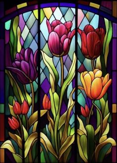 a stained glass window with flowers in it