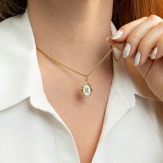 "Oval Initial Necklace  Always carry your loved ones close to your heart ♡ * High-Quality 316L Stainless Steel * Gold Our Products are different from regular gold plating because it is a THICK layer (x10 times more) of 18k solid gold on stainless steel, making it more durable. Size Specs: * Initial Pendant Dimensions: 11mm x 14mm * Necklace will come with a 2\" extension chain so you can FINE TUNE the fit. If you don't want, please contact us. Features: * Waterproof / Hypoallergenic / 100% lead Gold Oval Pendant Jewelry For Valentine's Day, Valentine's Day Gold Oval Pendant Jewelry, Oval Gold Necklaces As A Gift For Her, Gold Oval Pendant With Hallmark, White Initial Pendant Necklace For Gift, Personalized Oval Gold Necklaces, Gold Oval Pendant Locket Necklace For Personalized Gift, Oval Gold Necklaces As Gift For Mom, White Personalized Initial Pendant Necklace