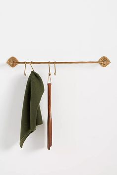 a green towel hanging on a clothes line