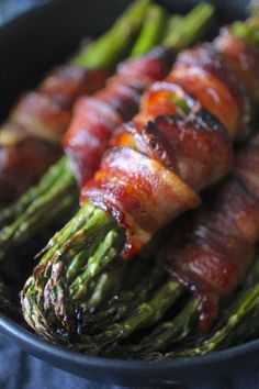 bacon wrapped asparagus in a black bowl