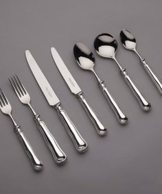 a set of five silver plated knives and spoons