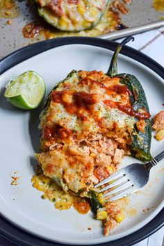 stuffed poblano peppers on a plate with a fork