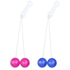 two different colored balls hanging from strings on a white background, one is blue and the other is pink