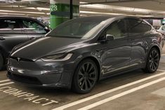 an electric car is parked in a parking garage